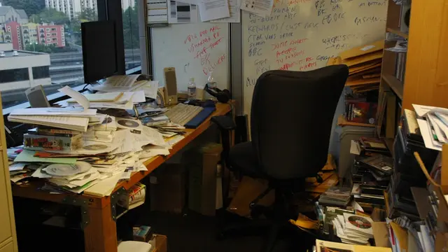 office table with pile of papers